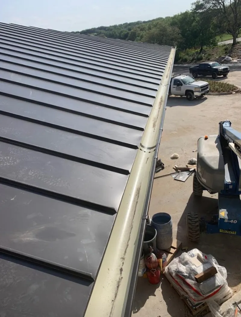 Standing seam panel and gutter detail on a metal roofing jobsite in Dulles Town Center